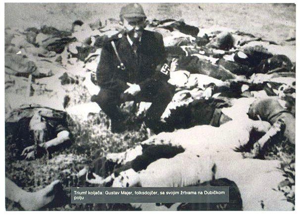 Facist Ustasa man poses among victims of Jasenovac